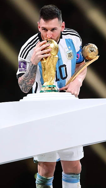 Messi holding the World Cup trophy